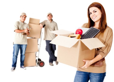Furniture and boxes being loaded into a local removals van