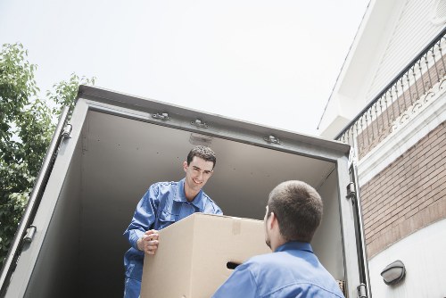 Packed office equipment and furniture ready for relocation in Stjohnswood