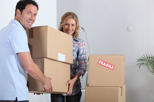 Local commercial movers handling desks and boxes near Stjohnswood offices
