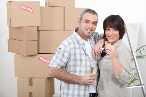 Packing materials and labeled moving boxes prepared for Stjohnswood relocation